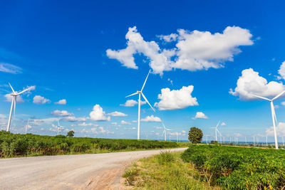 Windmill on field against sky