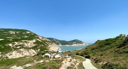 Scenic view of mountains against clear blue sky