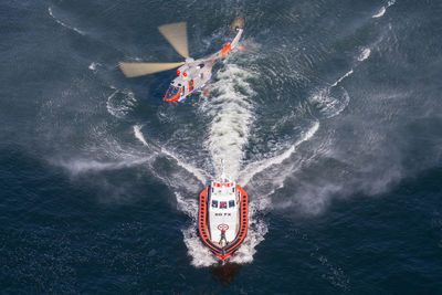 High angle view of people on boat in sea