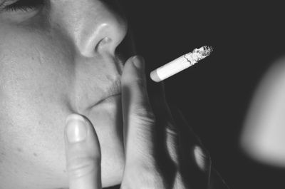 Close-up of woman smoking cigarette