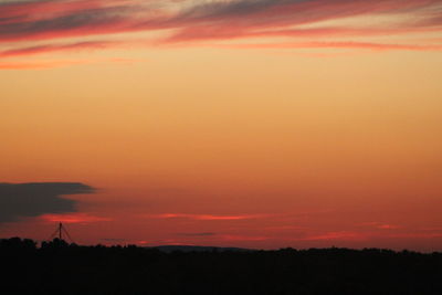 Silhouette of landscape against dramatic sky