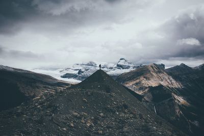 View of snowcapped mountain against cloudy sky