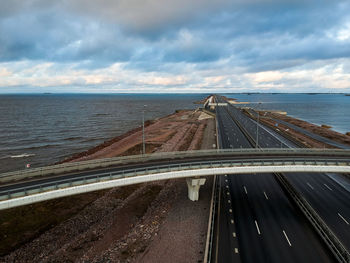 Road by sea against sky