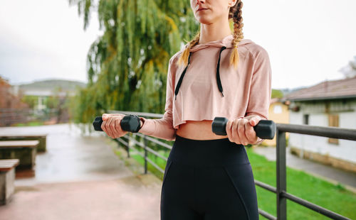 Rear view of woman exercising in gym