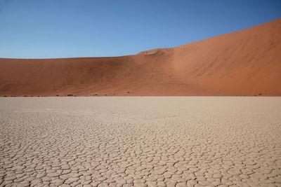 Scenic view of desert against clear sky