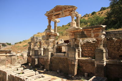 Low angle view of old ruins against clear sky