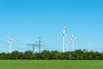 High voltage power lines and wind turbines seen in rural germany