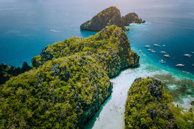 High angle view of rocks on sea shore