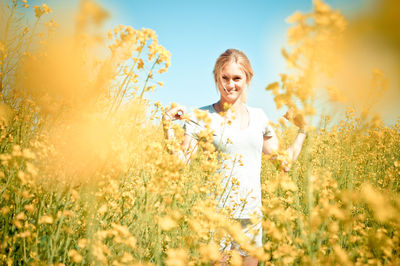 Portrait of woman on field