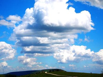 Scenic view of landscape against cloudy sky