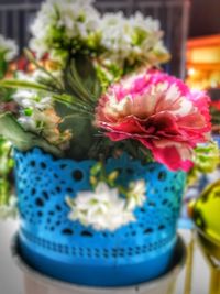 Close-up of pink roses on table