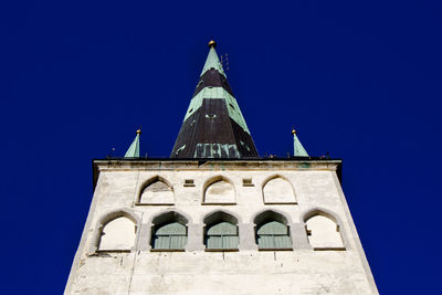 Low angle view of building against clear blue sky