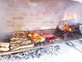 High angle view of meat on barbecue grill