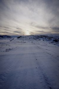 Scenic view of snow landscape against sky