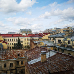 High angle view of buildings in town against sky