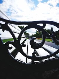 Low angle view of metal against sky