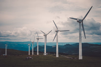 Wind turbines in field