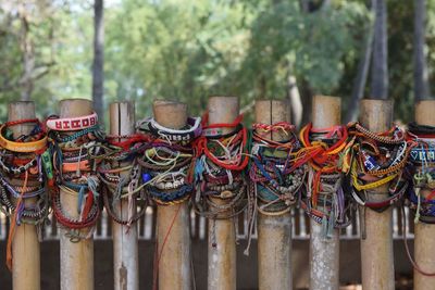 Close-up of bracelets on fence