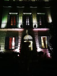 Low angle view of illuminated building at night