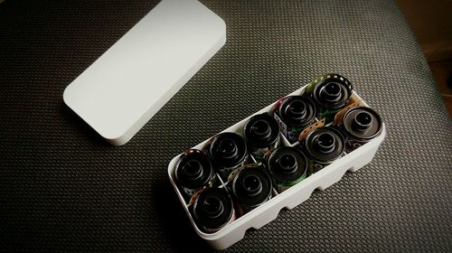 High angle view of camera films on table