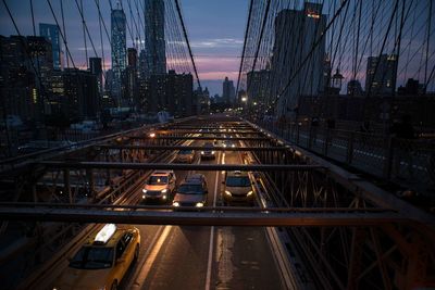 High angle view of cars on bridge in city at night