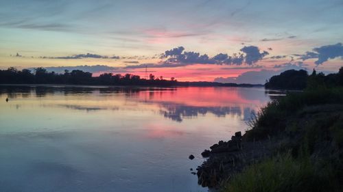 Scenic view of lake at sunset