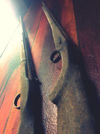 High angle view of chain on wood