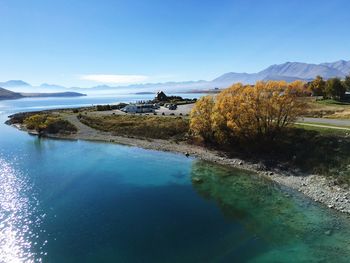 Scenic view of lake against blue sky