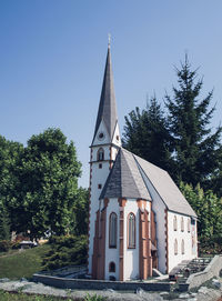 Church facade against clear blue sky