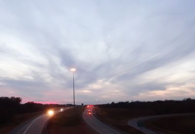 Cars on highway against sky