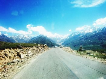 Road passing through snow covered mountains