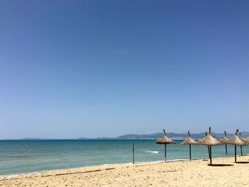 Scenic view of beach against clear sky