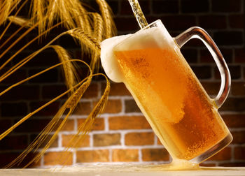 Close-up of beer glass on table