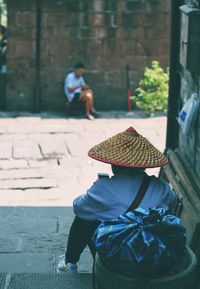 Rear view of man and woman in hat