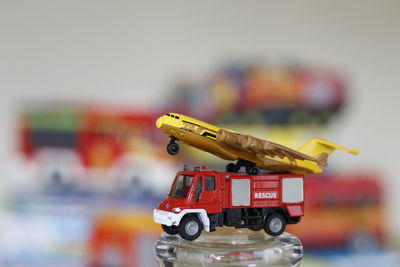 Close-up of toy car and plane on table