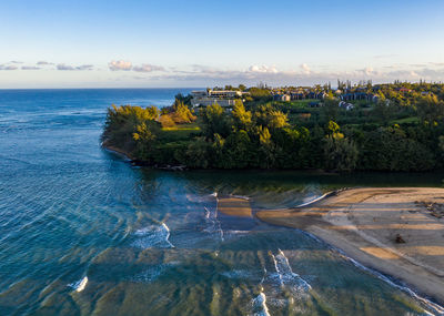 Aerial panoramic image at sunrise off the coast over hanalei bay and princeville on kauai