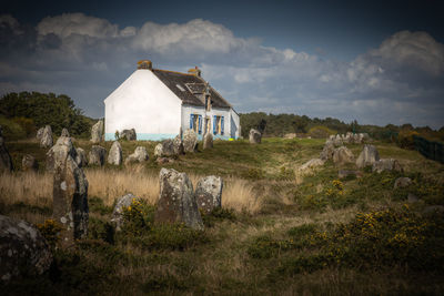 House on field against sky