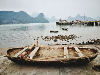 Boats moored on sea against sky