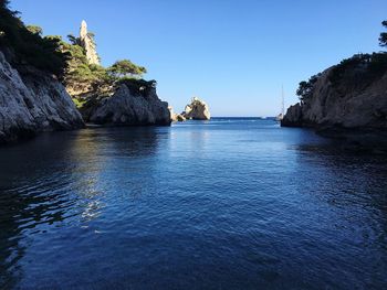 Scenic view of sea against clear blue sky