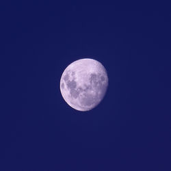 Low angle view of moon against clear sky at night