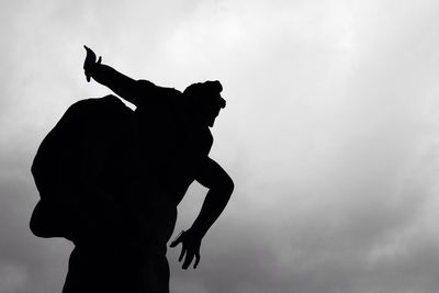 Low angle view of statue against sky