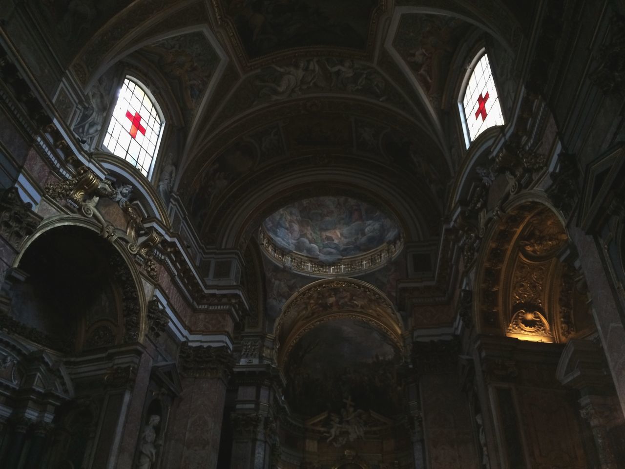 indoors, arch, place of worship, church, religion, architecture, spirituality, low angle view, built structure, ornate, ceiling, window, cathedral, interior, history, stained glass, architectural column, no people