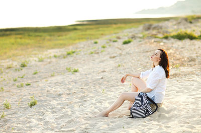 Woman sitting on beach