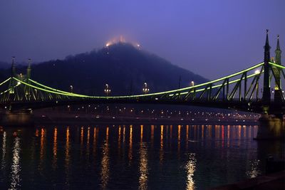 Liberty bridge over danube river at night