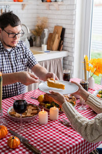 Midsection of woman preparing food at home