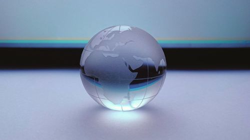 Close-up of glass ball on table