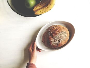 Cropped image of hand holding coffee