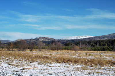 Scenic view of landscape against cloudy sky