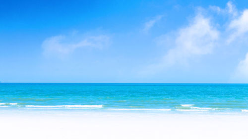 Scenic view of sea against blue sky