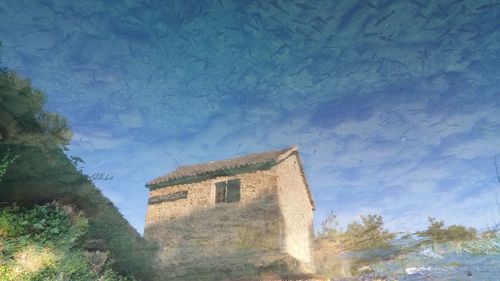 Low angle view of building against blue sky